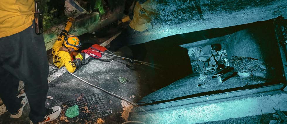 Rescatan a hombre tras caer a profunda alcantarilla de aguas lluvias en San Salvador